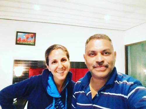 a man and a woman posing for a picture at Green Leaf Home Stay in Thekkady