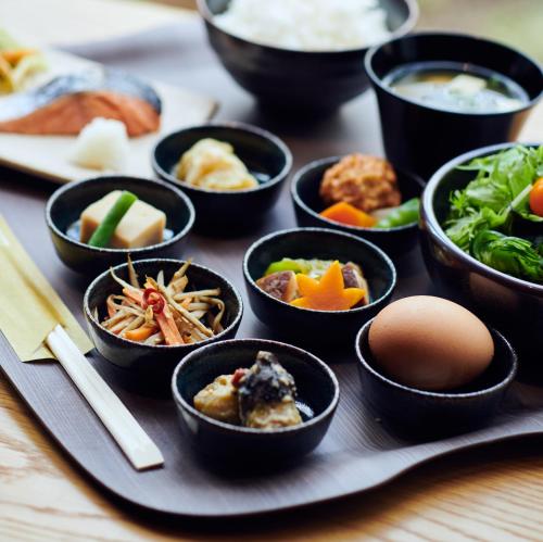 a tray with bowls of food on a table at hotel androoms Shin-Osaka in Osaka