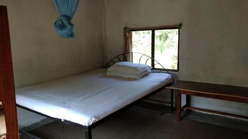 Postel nebo postele na pokoji v ubytování Chital lodge