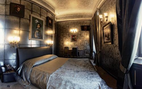 a bedroom with a large bed in a room at Antica Dimora Delle Cinque Lune in Rome