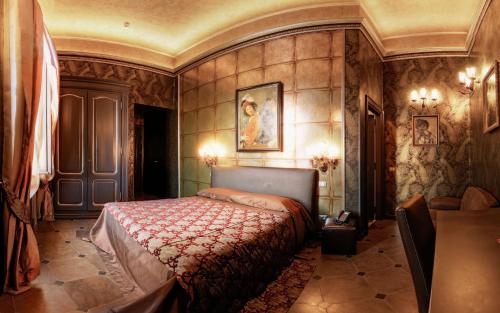 a bedroom with a bed in a room at Antica Dimora Delle Cinque Lune in Rome