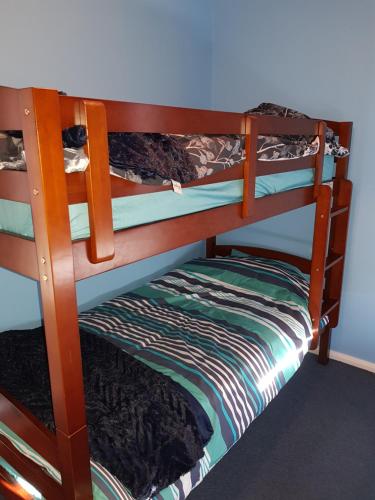 a couple of bunk beds in a room at Poss' Place in Rocky Cape