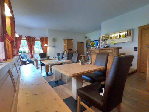 a dining room with a table and chairs at Villa Ortensia in San Vigilio Di Marebbe