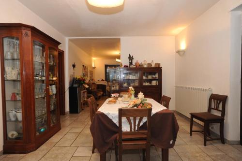 a dining room with a table and some chairs at L'antico Trullo - Masseria Chiancarella in Fasano