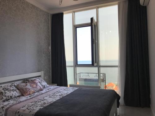Cama o camas de una habitación en Апартаменты в Аркадии с видом на море