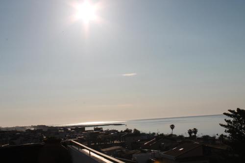 a view of the ocean from the roof of a building at Hotel Mediterraneo in Roccella Ionica