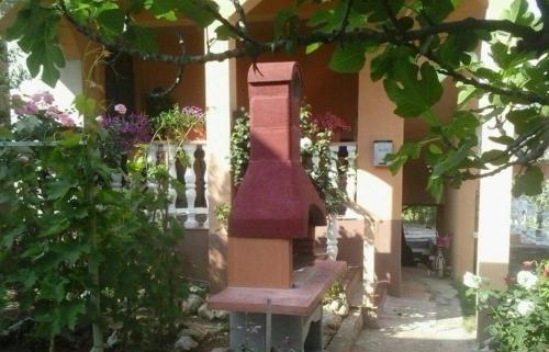 a bench sitting in front of a building at Studio Apartment in Nin with Balcony, Air Conditioning, Wi-Fi (3718-2) in Nin