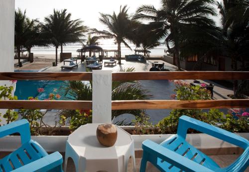 a view of a resort with two chairs and a pool at Palmazul Hotel & Spa in San Clemente