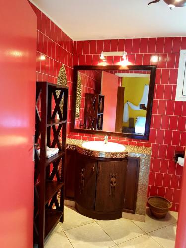 a bathroom with a sink and a mirror at Safari Village Saly V 225 in Saly Portudal