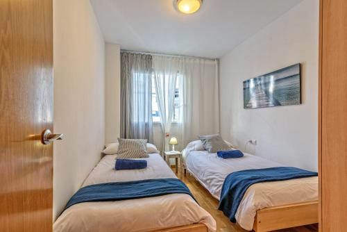 Postelja oz. postelje v sobi nastanitve Apartamento&piscina cerca de Barcelona