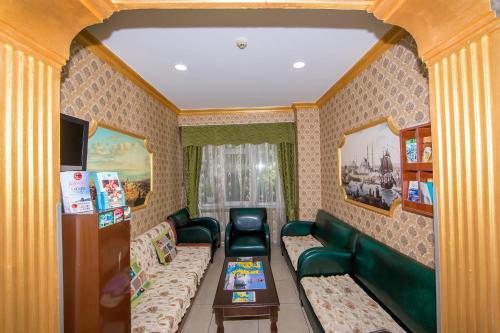 a living room with couches and a couch and a table at Meddusa Hotel in Istanbul