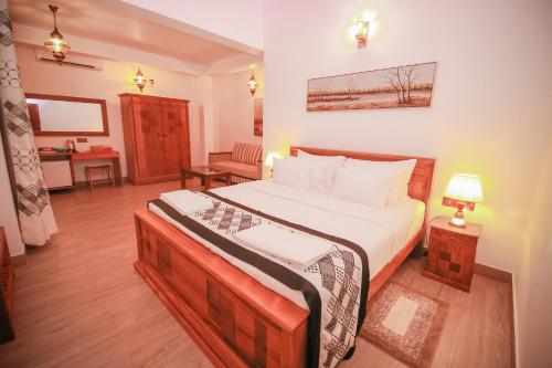 Un pat sau paturi într-o cameră la Villa Paradise