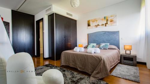Postel nebo postele na pokoji v ubytování Monte Laguna Duplex - Greice Homes