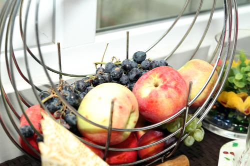 a bowl of fruit sitting on a table at Georgian Hosts Tbilisi in Tbilisi City