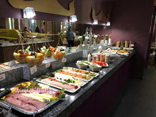 a buffet line with many different types of food at Post Hotel Weggis in Weggis