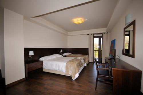 Кровать или кровати в номере Setta Alonia
