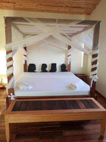 Katil atau katil-katil dalam bilik di Emeraude Lodge