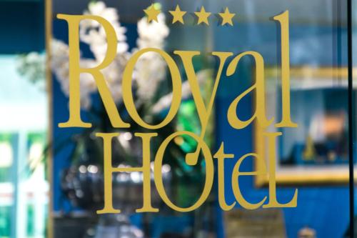 a gold sign in a window with stars on it at Hotel Royal in Fermo