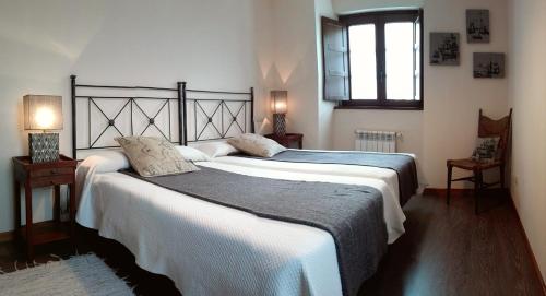 Katil atau katil-katil dalam bilik di Apartamentos Rurales Casanova