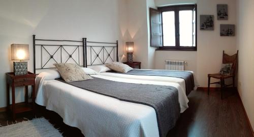 Postel nebo postele na pokoji v ubytování Apartamentos Rurales Casanova