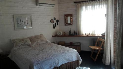 Postel nebo postele na pokoji v ubytování Homero y Martín Coronado