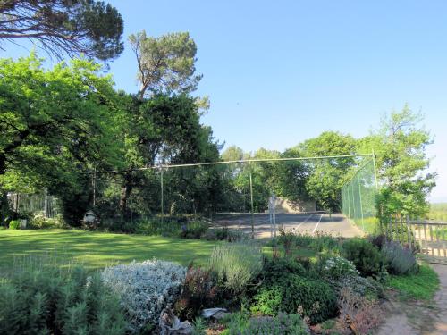 a garden with a gate in a yard at Modderkloof Farm Accommodation in Paarl