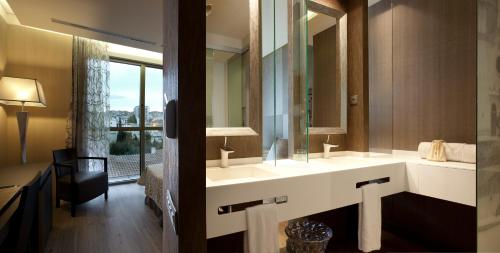 Ein Bett oder Betten in einem Zimmer der Unterkunft Hotel MiM Sitges & Spa