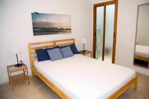 Un pat sau paturi într-o cameră la Gáldar G.C.Frontón