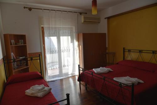 Posteľ alebo postele v izbe v ubytovaní La Terrazza Nascosta