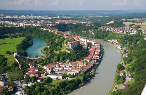 an aerial view of a town next to a river at Hotel Burgblick, bei Burghausen in Burghausen
