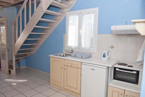 Η κουζίνα ή μικρή κουζίνα στο Angelina Apartments
