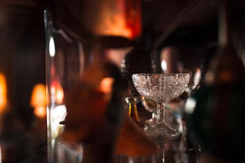 a row of wine glasses sitting on a table at Hôtel des Deux Clefs in Turckheim