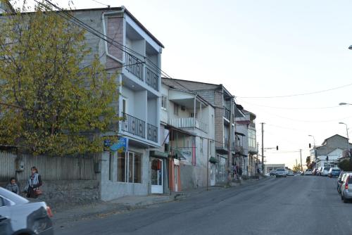 an empty street with buildings on the side of the road at My House in Akhaltsikhe in Akhaltsikhe