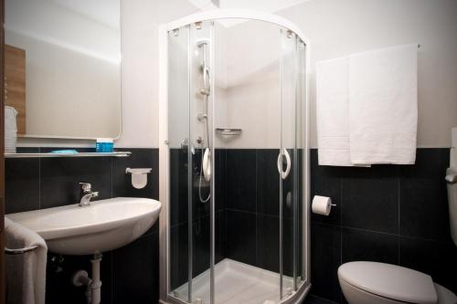 a bathroom with a shower and a sink at Hotel Delle Nazioni - Adults Only in Caorle