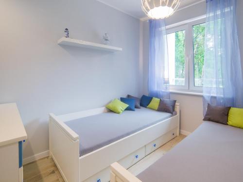 Кровать или кровати в номере Apartament Turkusowy
