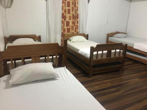 Una cama o camas en una habitación de Hostel Orozco - Costa Rica