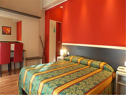 Ένα ή περισσότερα κρεβάτια σε δωμάτιο στο Hotel David