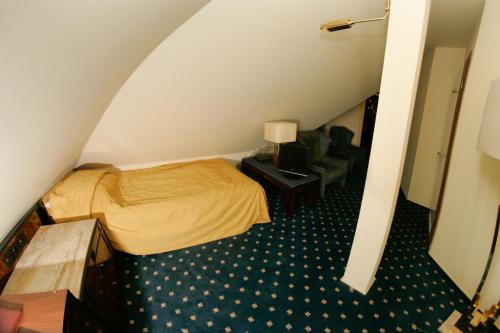Ένα ή περισσότερα κρεβάτια σε δωμάτιο στο Hotel Podzamcze