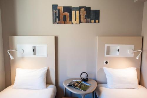 Кровать или кровати в номере Ibis Budget Château-Thierry
