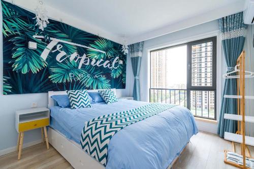 a bedroom with a blue bed with a tropical wall at Henan Luoyang·Luo River· Locals Apartment 00137320 in Luoyang
