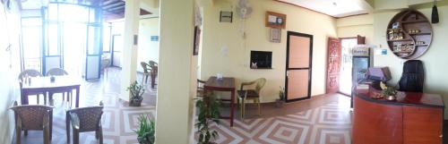 two views of a room with a kitchen and a hallway at Begnas Coffee House & Hotel in Deorāli