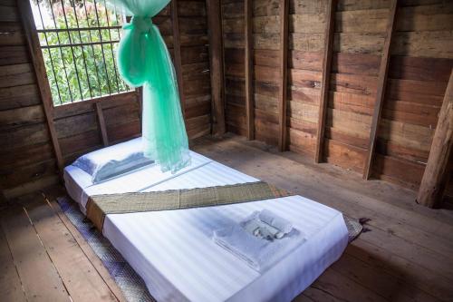 Ένα ή περισσότερα κρεβάτια σε δωμάτιο στο Chansor Homestay 7 By Siem Reap Homesteading