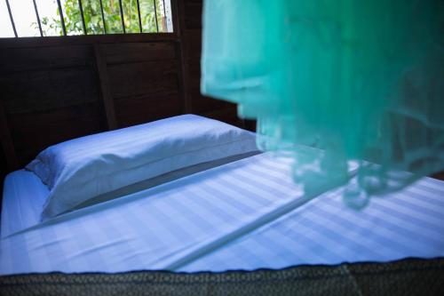 Ένα ή περισσότερα κρεβάτια σε δωμάτιο στο Chansor Homestay 7 By Siem Reap Homesteading