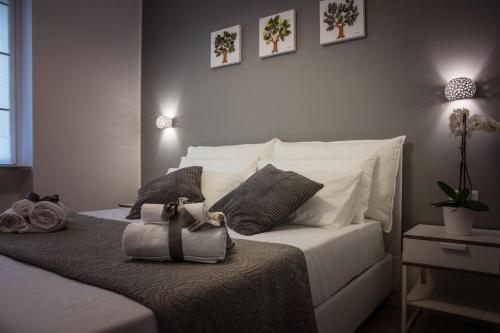 Un pat sau paturi într-o cameră la Divina Guesthouse