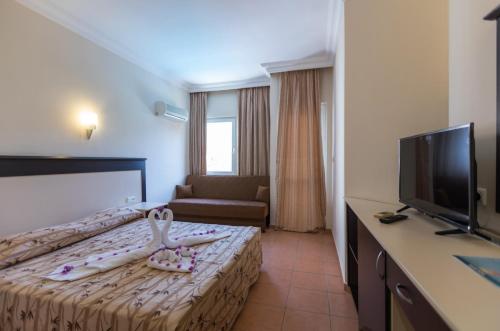 Postel nebo postele na pokoji v ubytování Helios Hotel