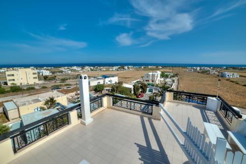 a balcony with a view of a city at Pantheon Hotel in Perivolos