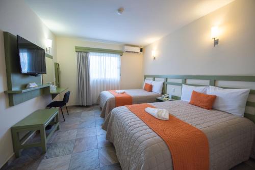Postel nebo postele na pokoji v ubytování Hotel Palace Inn