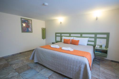 Postel nebo postele na pokoji v ubytování Hotel Palace Inn