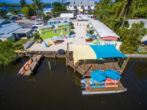 an aerial view of a marina with umbrellas at Matlacha Tiny Village in Matlacha