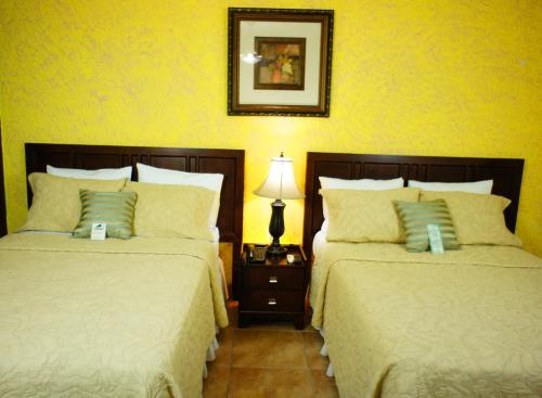 Postel nebo postele na pokoji v ubytování Hotel Cafe